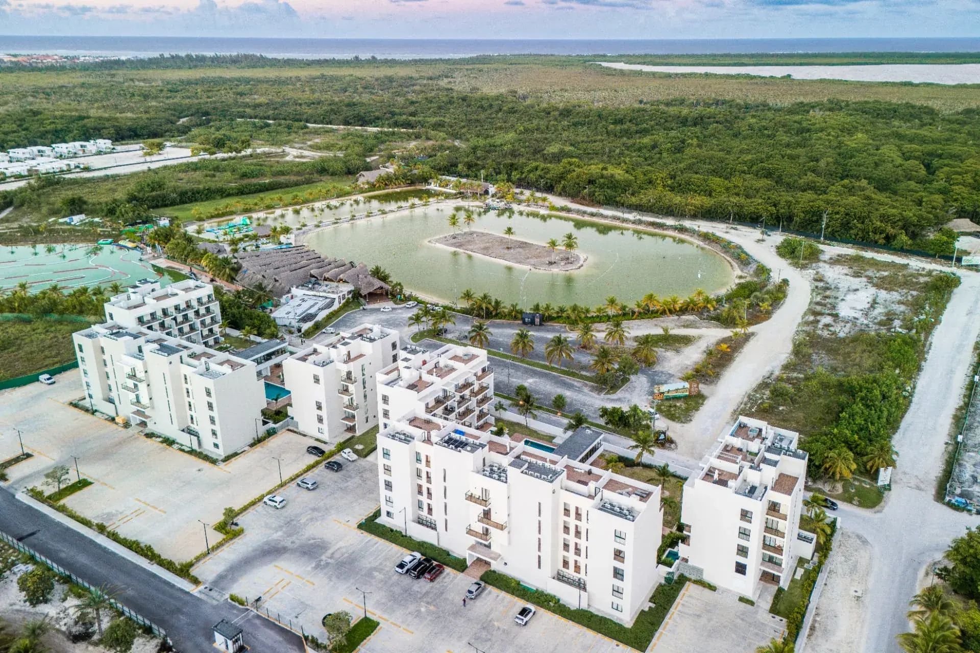 Aerial view of the DownTown buildings with the lagoon, palms and the ocean on the horizon